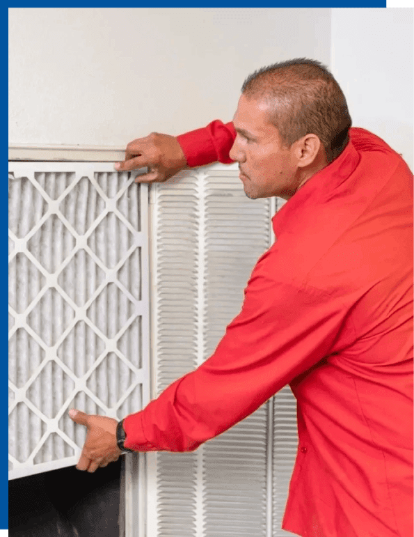 A man in red shirt fixing air filter.